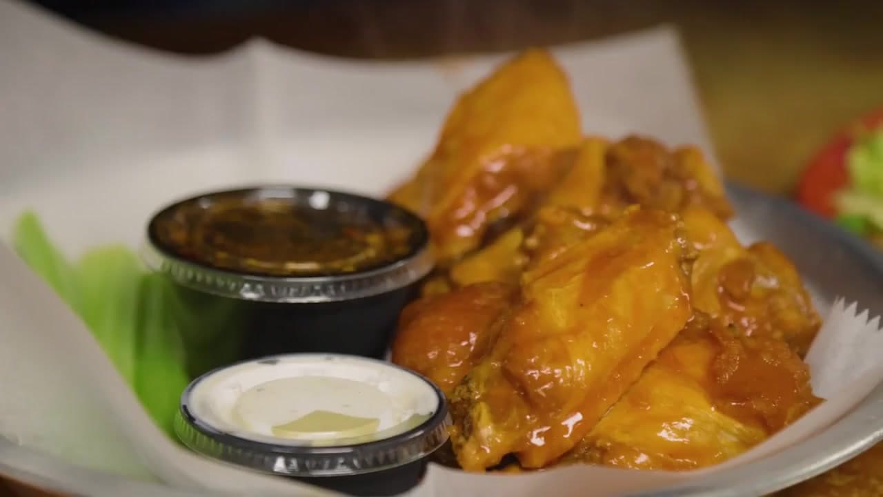 A basket of sauced wings served at Jack's Seafood Bar & Grill