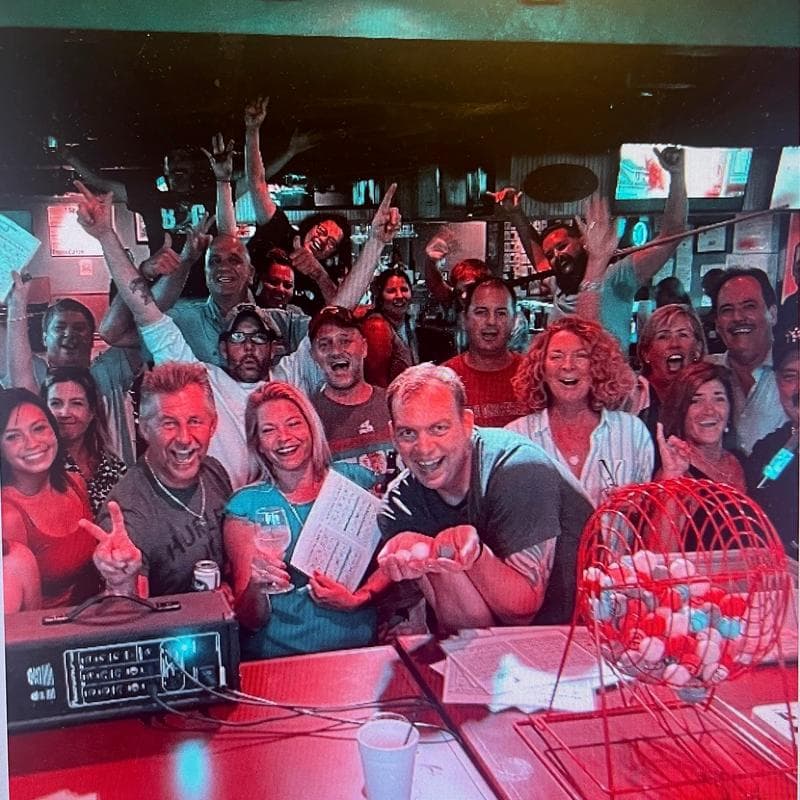 Friends gathering inside Jack's Seafood Bar & Grill in North Naples