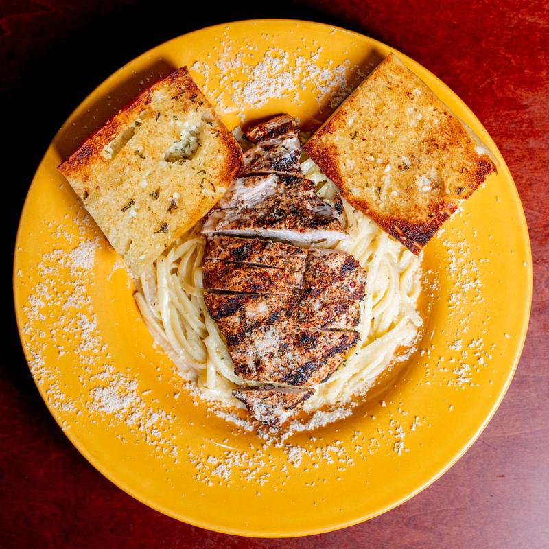 Jerk Chicken Alfredo over linguine with garlic bread